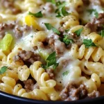 Philly Cheesesteak Pasta with ground beef, green bell peppers, and melted cheese